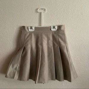 beige pleated mini skirt